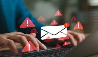 Person on laptop suffering data breach