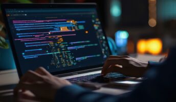 User coding a GPT on their laptop