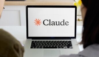Claude AI on laptop being looked