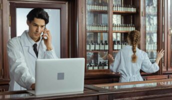 A pharmacy uses laptop to handle sales