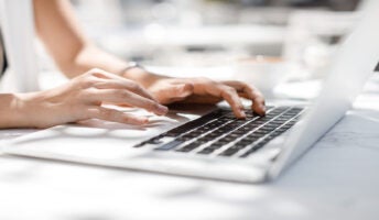 Person typing on laptop