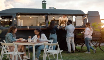 People queuing for food trucks
