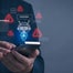 Individual on phone with AI and danger symbols graphic above